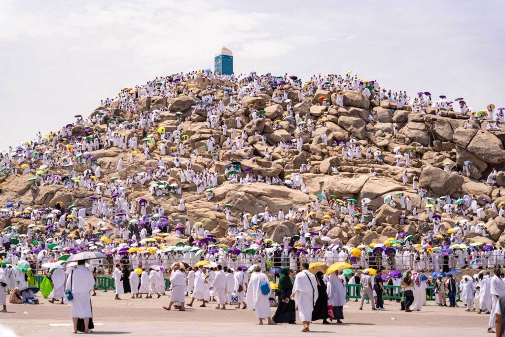 Pilgrims listening to their guide during a Ziyarat tour